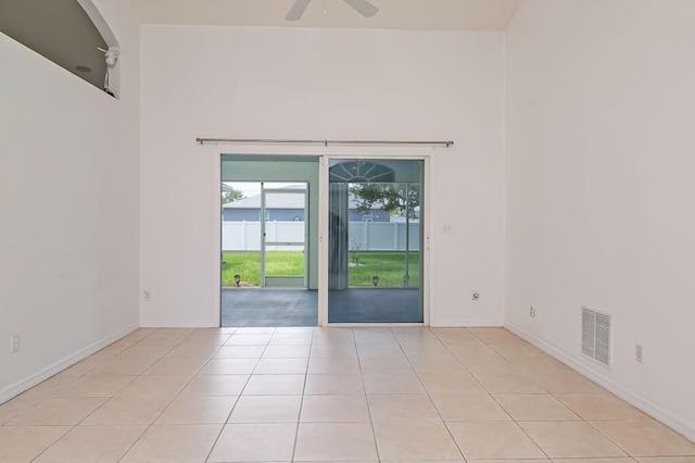 2062 SW Scorpio Ln, Port Saint Lucie, FL 34984 - empty room with ceiling fan and light tile patterned floors