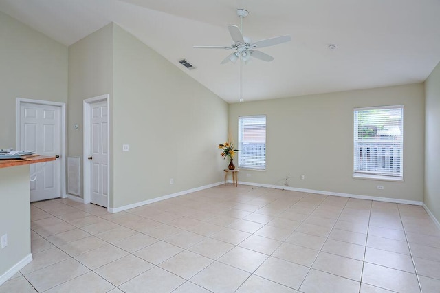 2062 SW Scorpio Ln, Port Saint Lucie, FL 34984 - empty room featuring a ceiling fan, high vaulted ceiling, and light tile patterned floors
