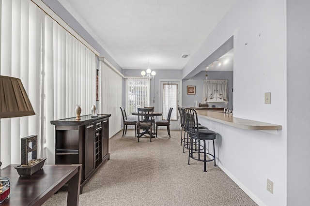 1261 NW 44th St, Deerfield Beach, FL 33064 - dining room with a chandelier and carpet floors