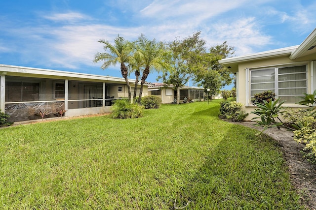 1261 NW 44th St, Deerfield Beach, FL 33064 - view of green lawn with a sunroom