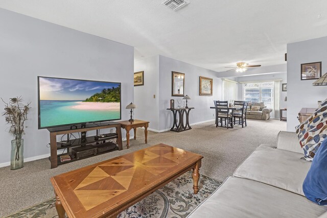 1261 NW 44th St, Deerfield Beach, FL 33064 - carpeted living area featuring baseboards and ceiling fan