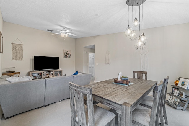 241 Meadows Dr Unit 241, Boynton Beach, FL 33436 - dining area featuring ceiling fan and a textured ceiling