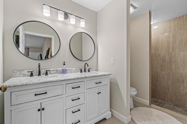 241 Meadows Dr Unit 241, Boynton Beach, FL 33436 - bathroom featuring double vanity and a tile shower