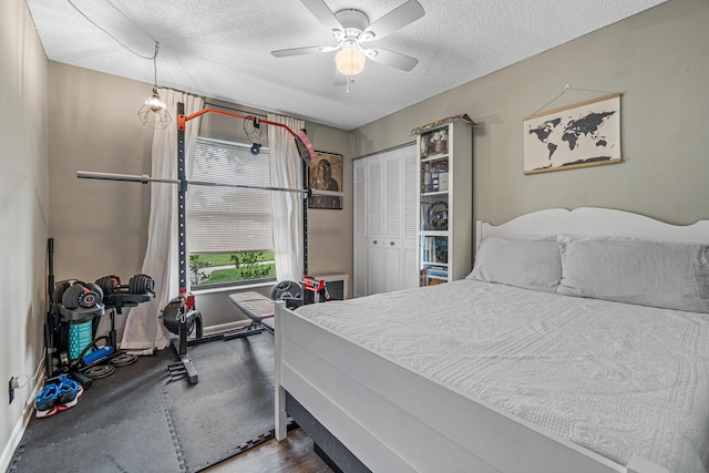 241 Meadows Dr Unit 241, Boynton Beach, FL 33436 - bedroom with a textured ceiling, a ceiling fan, and a closet