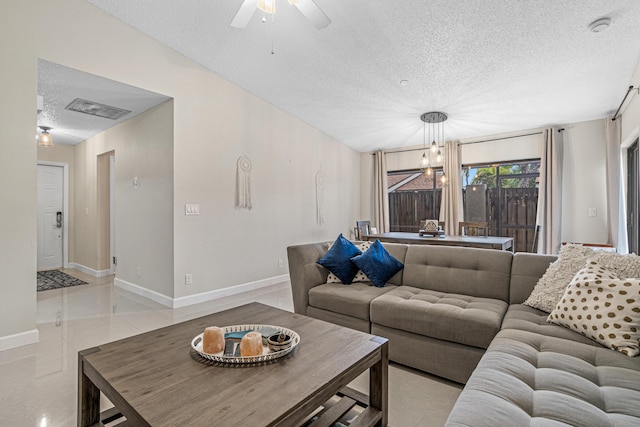 241 Meadows Dr Unit 241, Boynton Beach, FL 33436 - living room with a textured ceiling, ceiling fan, a chandelier, and light tile patterned flooring