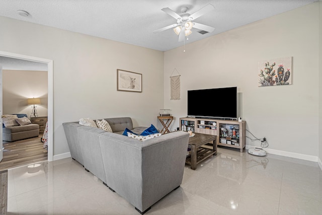 241 Meadows Dr Unit 241, Boynton Beach, FL 33436 - living room with a ceiling fan, a textured ceiling, and light marble finish flooring