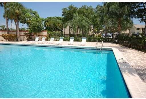 21950 Soundview Ter Unit 107, Boca Raton, FL 33433 - community pool featuring a patio