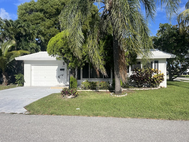 2491 NW 2nd Ter, Pompano Beach, FL 33064 - view of property hidden behind natural elements featuring a garage, stucco siding, concrete driveway, and a front lawn