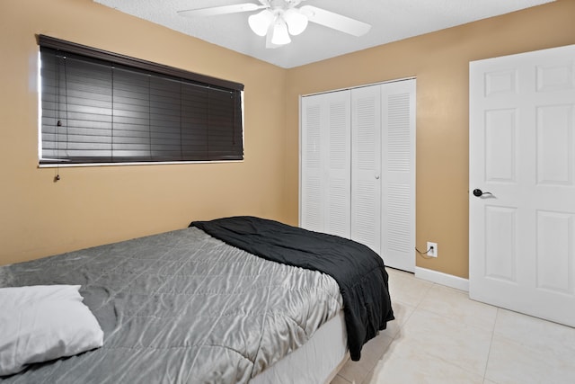 7750 NW 50th St Unit 106, Lauderhill, FL 33351 - bedroom featuring a closet, light tile patterned floors, and a ceiling fan