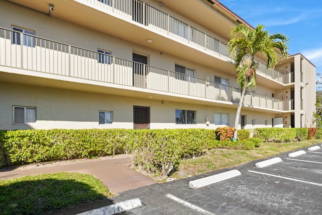7750 NW 50th St Unit 106, Lauderhill, FL 33351 - view of apartment building / complex featuring uncovered parking