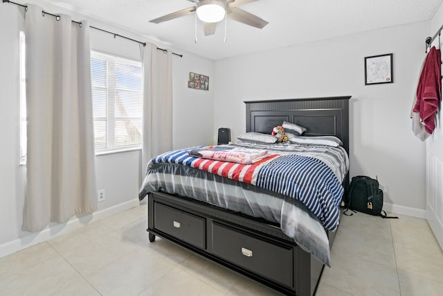 7750 NW 50th St Unit 106, Lauderhill, FL 33351 - bedroom with light tile patterned flooring and a ceiling fan