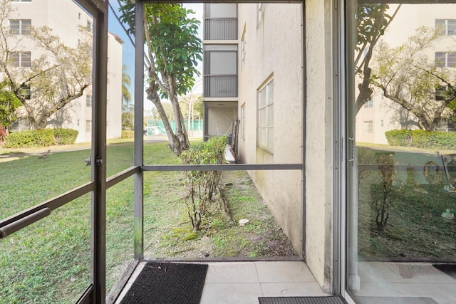 7750 NW 50th St Unit 106, Lauderhill, FL 33351 - unfurnished sunroom featuring healthy amount of natural light