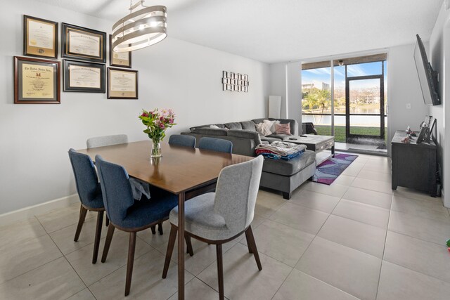7750 NW 50th St Unit 106, Lauderhill, FL 33351 - dining room featuring expansive windows and light tile patterned floors