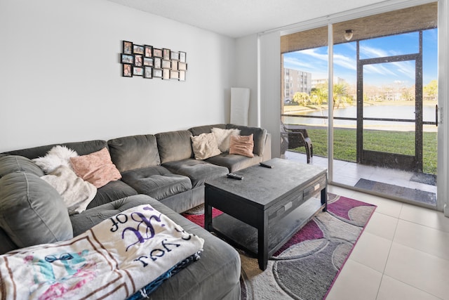 7750 NW 50th St Unit 106, Lauderhill, FL 33351 - living area featuring tile patterned floors, a water view, and a wall of windows