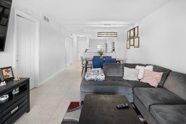 7750 NW 50th St Unit 106, Lauderhill, FL 33351 - living room featuring light tile patterned floors
