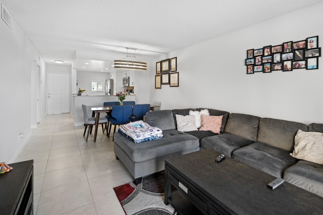 7750 NW 50th St Unit 106, Lauderhill, FL 33351 - living room featuring light tile patterned flooring, a textured ceiling, and recessed lighting