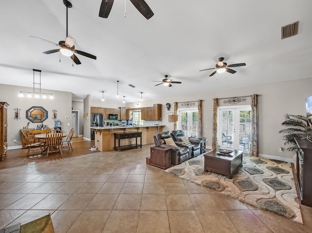 5301 Bald Cypress Trl, Fort Pierce, FL 34951 - living room with ceiling fan, light tile patterned flooring, and lofted ceiling