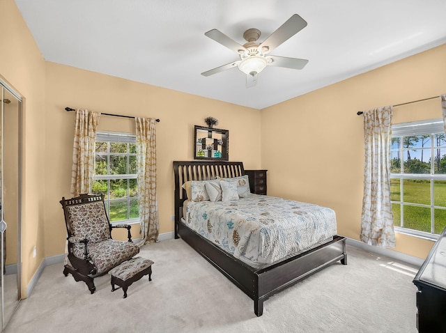5301 Bald Cypress Trl, Fort Pierce, FL 34951 - bedroom featuring multiple windows, carpet, and ceiling fan