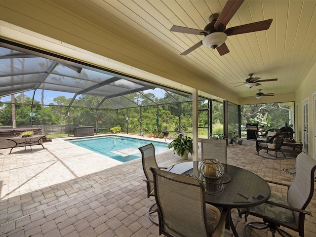 5301 Bald Cypress Trl, Fort Pierce, FL 34951 - swimming pool featuring a patio, ceiling fan, and glass enclosure