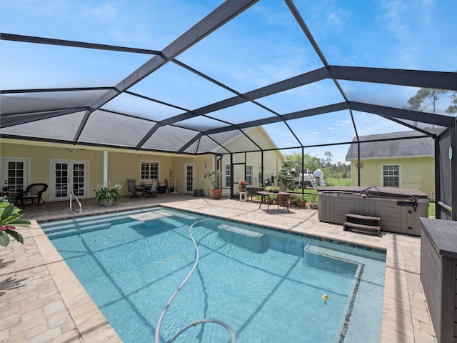 5301 Bald Cypress Trl, Fort Pierce, FL 34951 - swimming pool featuring french doors, a hot tub, a patio area, and a lanai