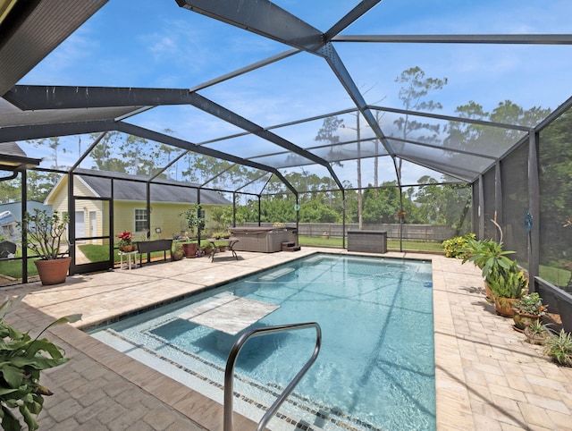 5301 Bald Cypress Trl, Fort Pierce, FL 34951 - outdoor pool featuring a hot tub, a patio, a fenced backyard, and glass enclosure