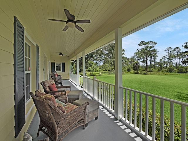 5301 Bald Cypress Trl, Fort Pierce, FL 34951 - porch featuring ceiling fan and a lawn