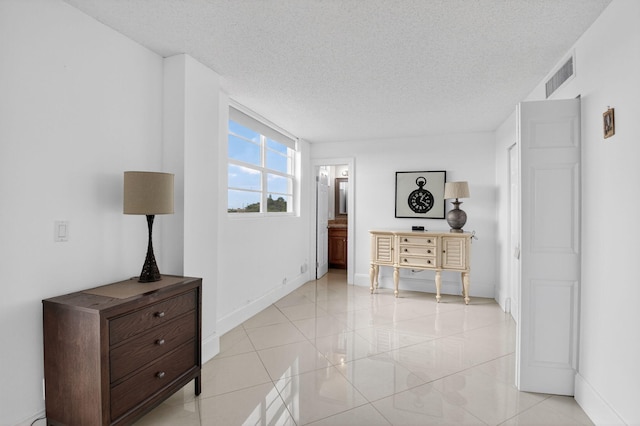 5500 NW 2nd Ave Unit 718, Boca Raton, FL 33487 - hallway featuring a textured ceiling and baseboards