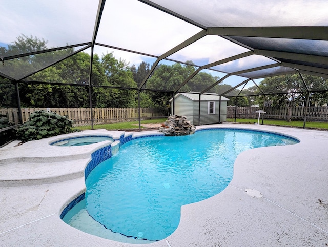 3074 SE Dalhart Rd, Port Saint Lucie, FL 34952 - view of swimming pool with a fenced backyard, glass enclosure, a pool with connected hot tub, and a storage unit