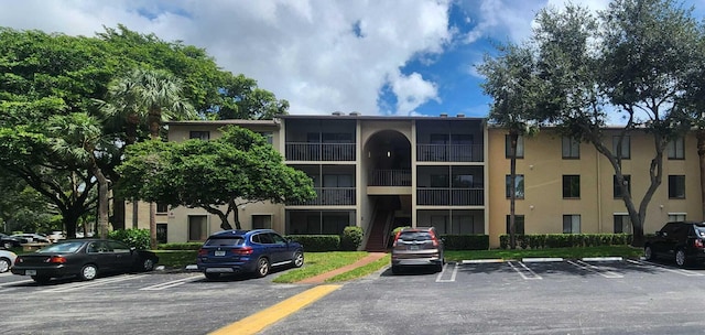 206 Foxtail Dr Unit D1, Greenacres, FL 33415 - view of property featuring uncovered parking