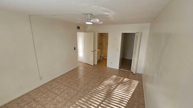 206 Foxtail Dr Unit D1, Greenacres, FL 33415 - tiled empty room with a ceiling fan and a textured ceiling