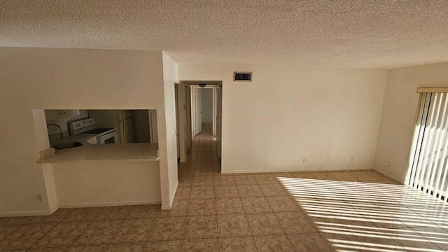 206 Foxtail Dr Unit D1, Greenacres, FL 33415 - unfurnished room featuring a textured ceiling