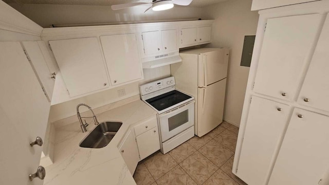206 Foxtail Dr Unit D1, Greenacres, FL 33415 - kitchen with white appliances, under cabinet range hood, light countertops, and electric panel