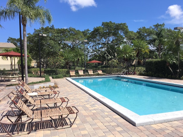 751 Cypress Ln Unit K, Deerfield Beach, FL 33064 - community pool featuring a patio