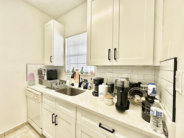 751 Cypress Ln Unit K, Deerfield Beach, FL 33064 - kitchen featuring dishwasher, tasteful backsplash, and white cabinetry