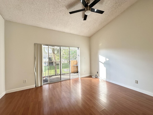 751 Cypress Ln Unit K, Deerfield Beach, FL 33064 - unfurnished room featuring a textured ceiling, a ceiling fan, wood finished floors, and lofted ceiling