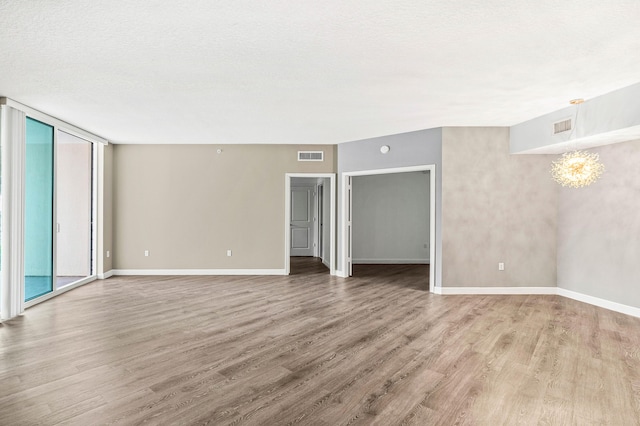350 N Federal Hwy Unit 609, Boynton Beach, FL 33435 - spare room with wood finished floors and a chandelier