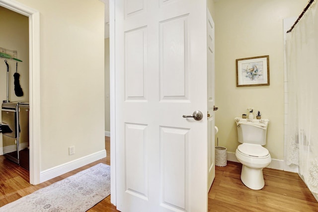 16174 SW 9th St, Pembroke Pines, FL 33027 - bathroom with wood finished floors and a shower with curtain