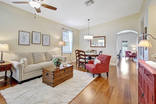 16174 SW 9th St, Pembroke Pines, FL 33027 - living area featuring arched walkways, lofted ceiling, healthy amount of natural light, a ceiling fan, and light wood-type flooring
