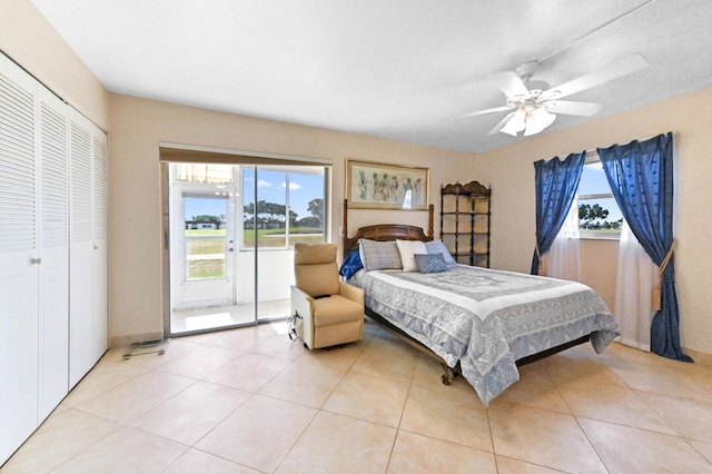154 Tuscany C, Delray Beach, FL 33446 - bedroom featuring a closet, a ceiling fan, and light tile patterned floors