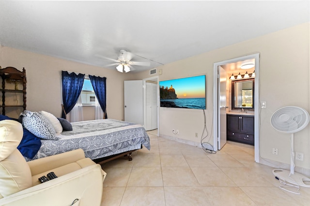 154 Tuscany C, Delray Beach, FL 33446 - bedroom with light tile patterned floors, ensuite bath, and a ceiling fan