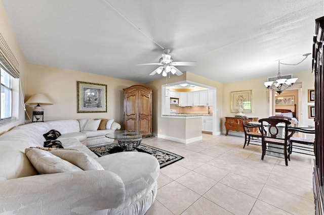 154 Tuscany C, Delray Beach, FL 33446 - living room featuring a chandelier, light tile patterned floors, and ceiling fan