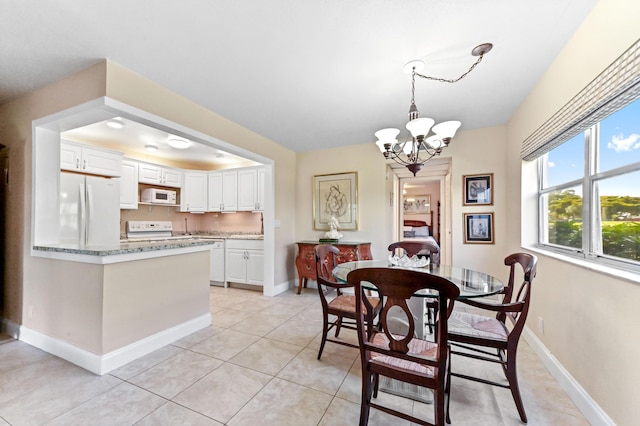 154 Tuscany C, Delray Beach, FL 33446 - dining room with a chandelier and light tile patterned flooring