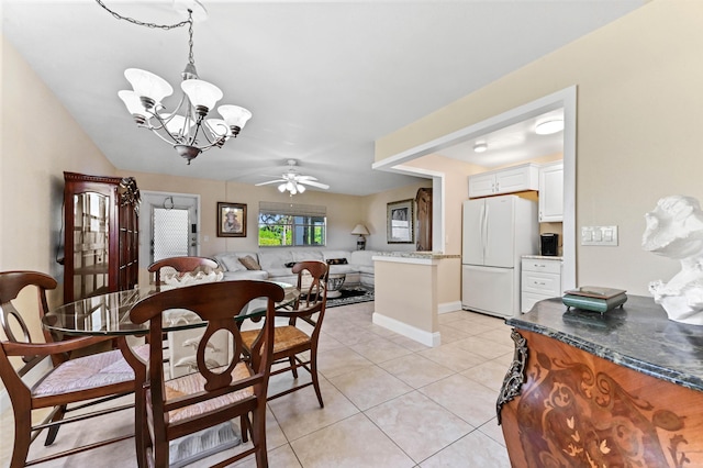 154 Tuscany C, Delray Beach, FL 33446 - dining space with a chandelier, ceiling fan, and light tile patterned floors