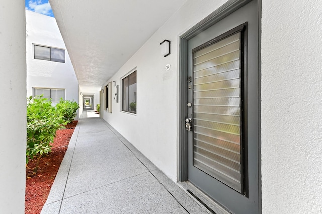 15054 Ashland Way Unit 84, Delray Beach, FL 33484 - doorway to property with stucco siding