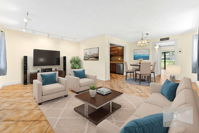 15054 Ashland Way Unit 84, Delray Beach, FL 33484 - living room with light tile patterned flooring, a chandelier, and rail lighting