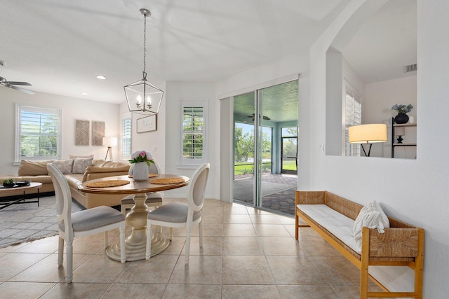 709 SW Sun Cir, Palm City, FL 34990 - dining space with tile patterned flooring, a chandelier, recessed lighting, and arched walkways