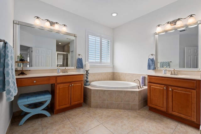 709 SW Sun Cir, Palm City, FL 34990 - bathroom featuring vanity, tile patterned floors, a garden tub, a stall shower, and recessed lighting
