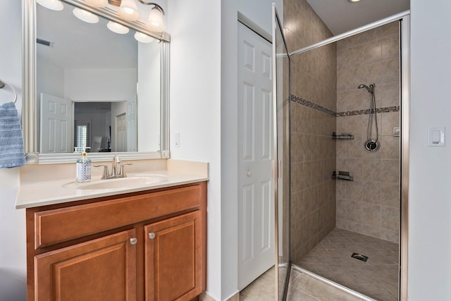 709 SW Sun Cir, Palm City, FL 34990 - bathroom featuring vanity, a shower stall, and tile patterned flooring