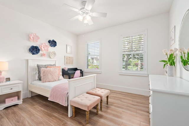 709 SW Sun Cir, Palm City, FL 34990 - bedroom featuring light wood-type flooring and ceiling fan
