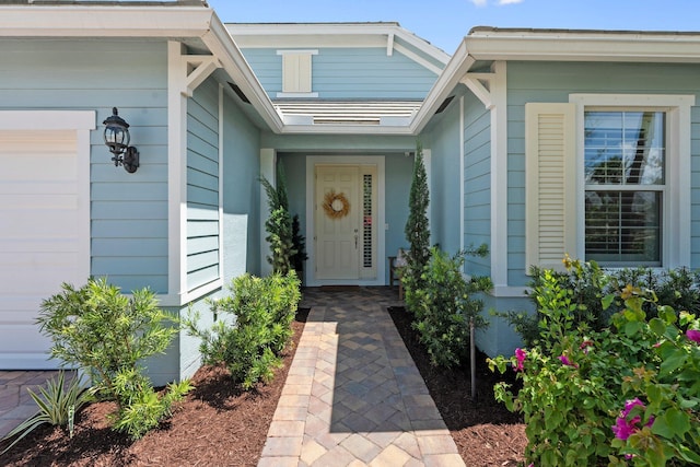 709 SW Sun Cir, Palm City, FL 34990 - property entrance with an attached garage